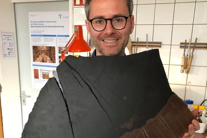 Frederic Lens with a piece of ebony